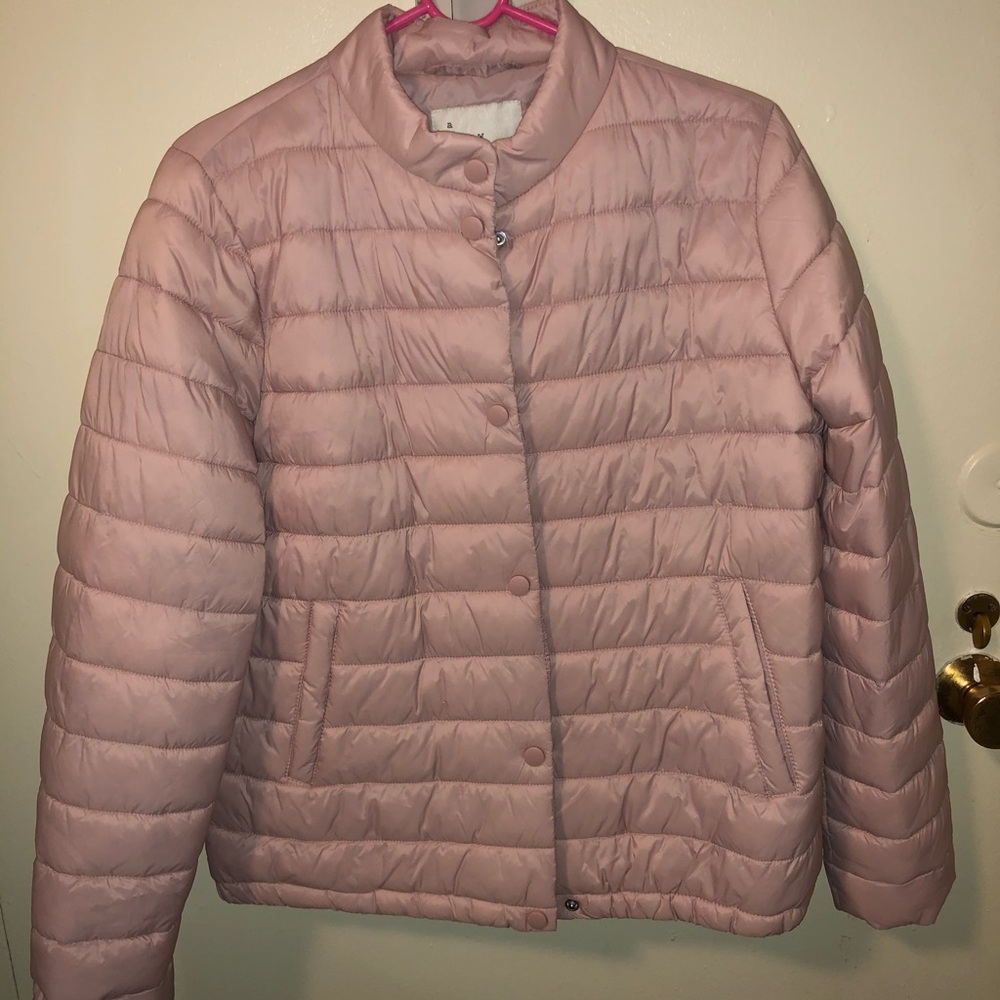 Pink puffer jacket.
